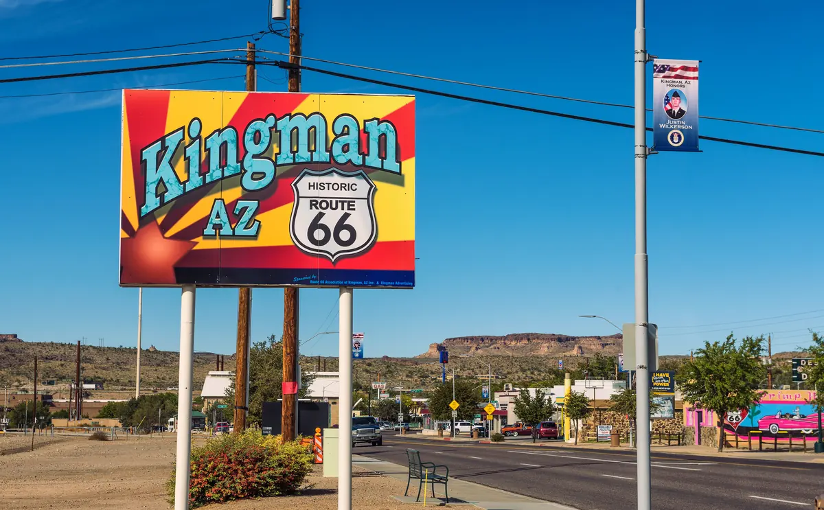 A Kingman Arizona Historic Route 66 sign along the highway