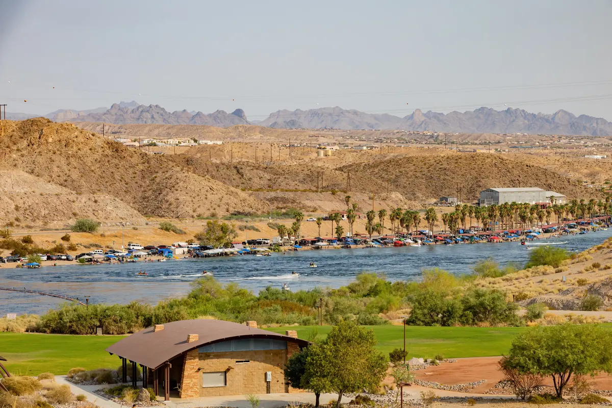 The Colorado River shoreline at Bullhead City with desert hills beyond